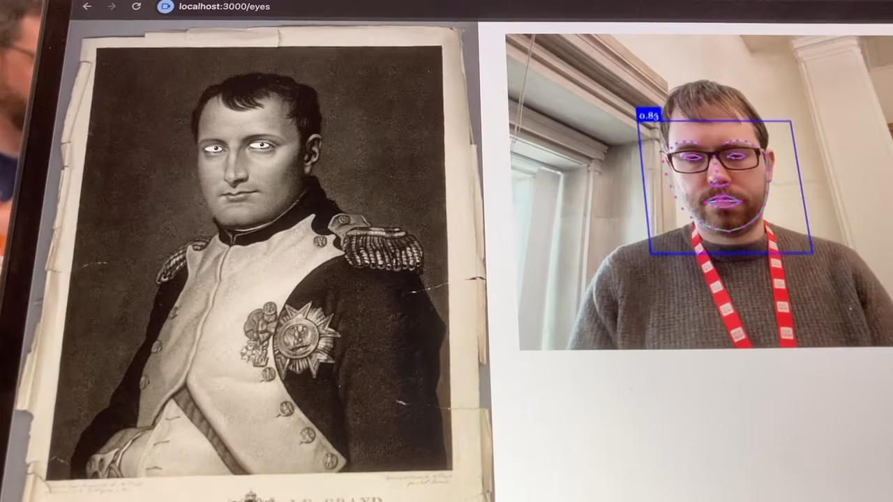 A historical portrait with animated eyes beside a webcam view tracking a viewer's face
