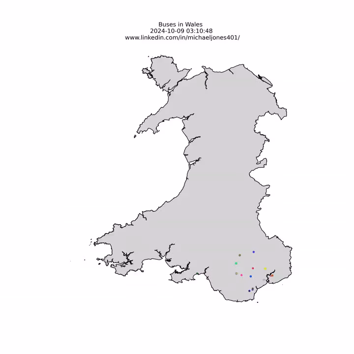 A map of Wales with coloured points representing buses moving around the country